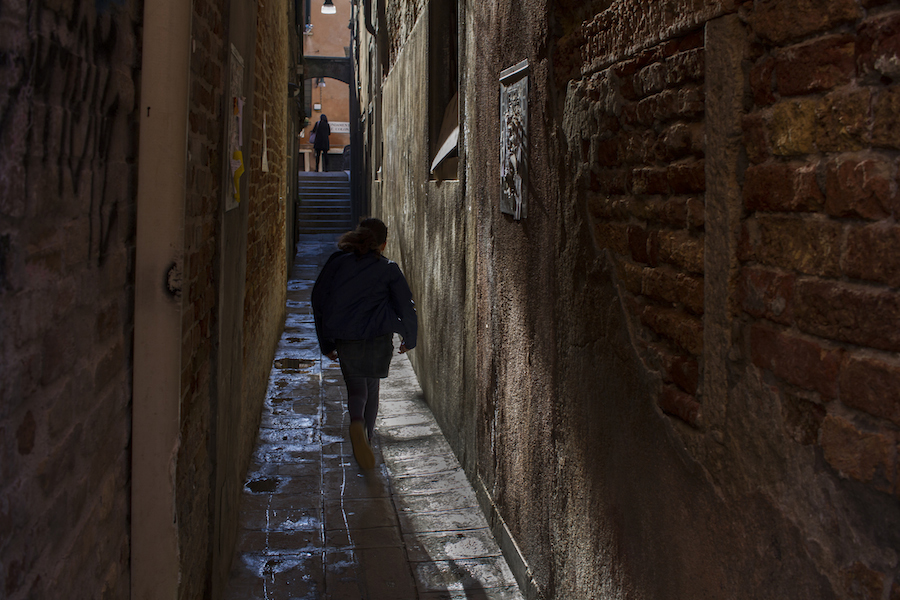 Girl running in Venice