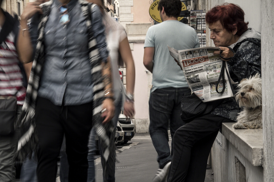 Woman reading newspaper